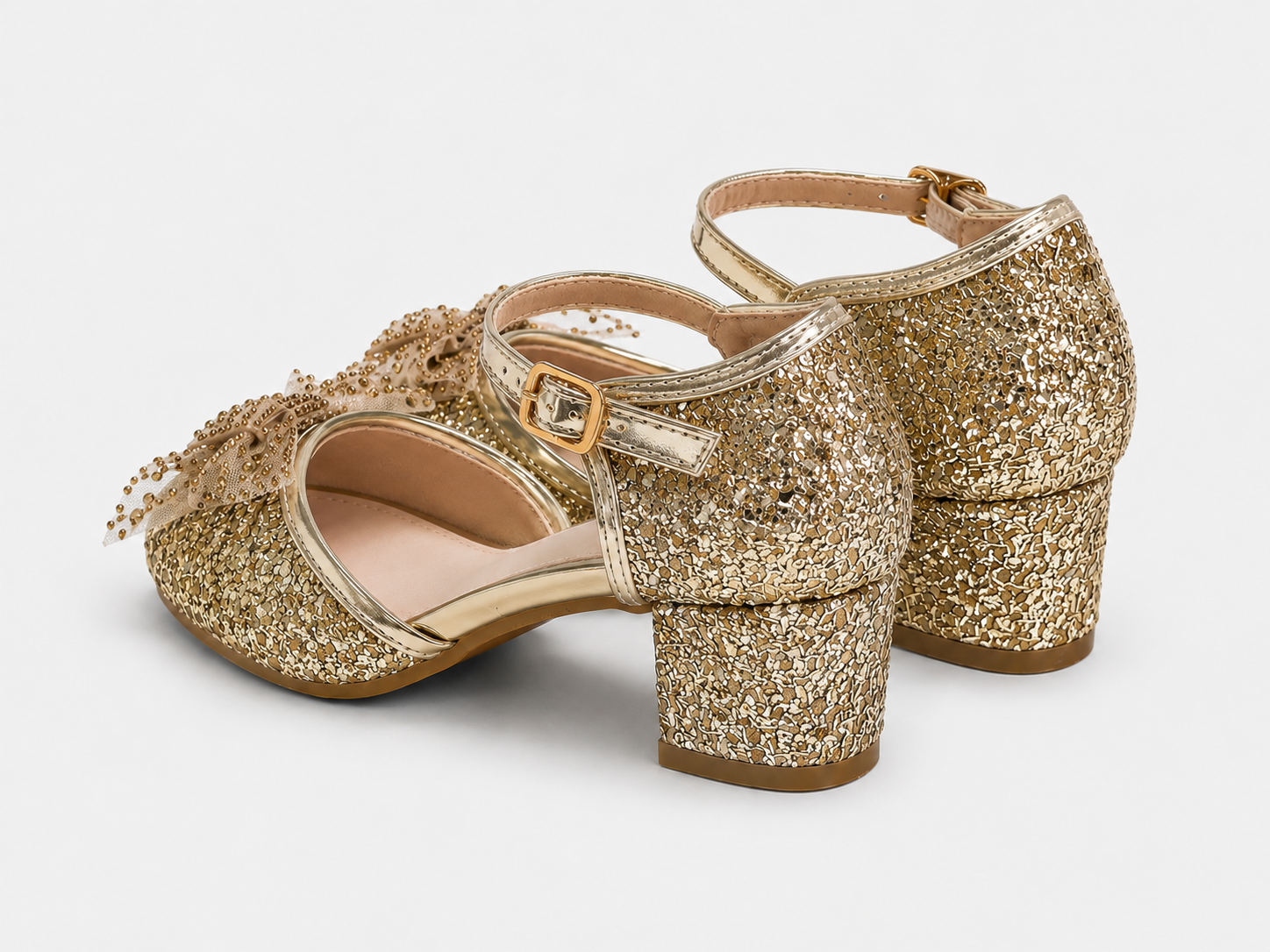 low block heel view of Bella gold glitter heels