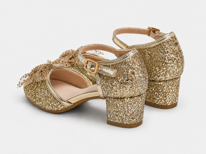 low block heel view of Bella gold glitter heels